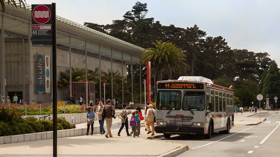 Muni bus 44 in front of the California Academy of Sciences building.