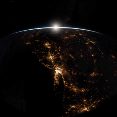Artist rendering of moon rising over Earth