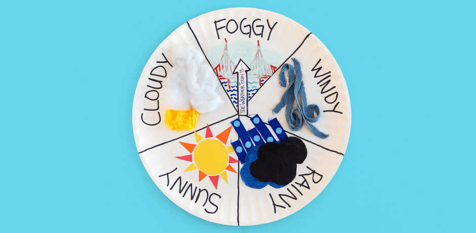 Handmade backyard weather dial against light blue background