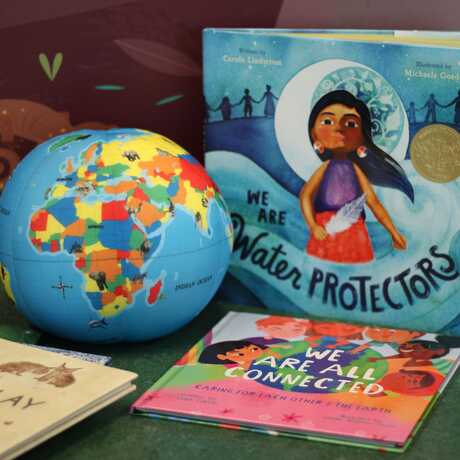 image of globe and three story books